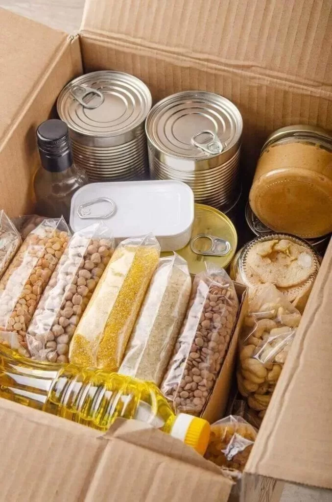 Assorted food items in a cardboard box.