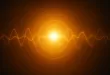 Abstract waves and light rays in golden colors.