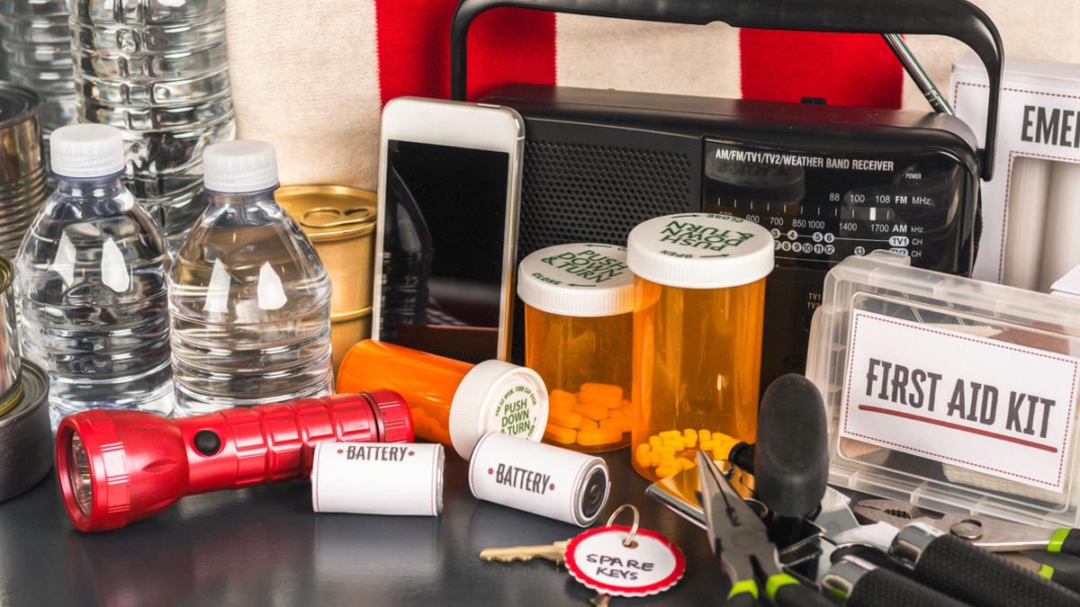 Emergency preparedness supplies including water, flashlight, and first aid.
