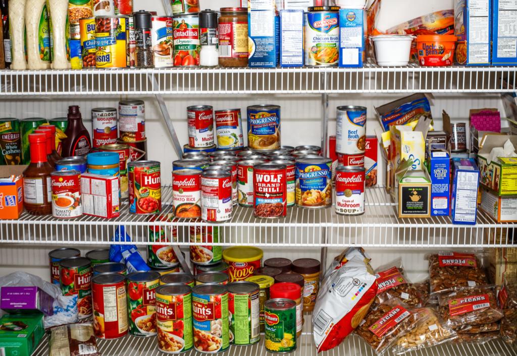 organized pantry filled with various canned goods